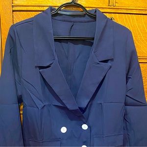 Brand new never worn navy blue jacket with white buttons. Boxy style.